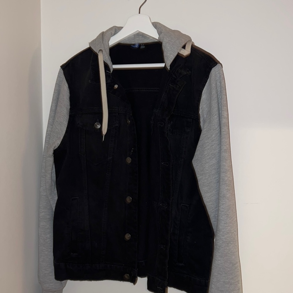 half grey sweater, half black denim jacket